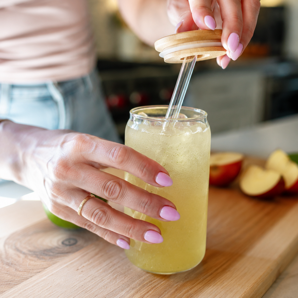Veggie Sips yellow drink with ice held by woman